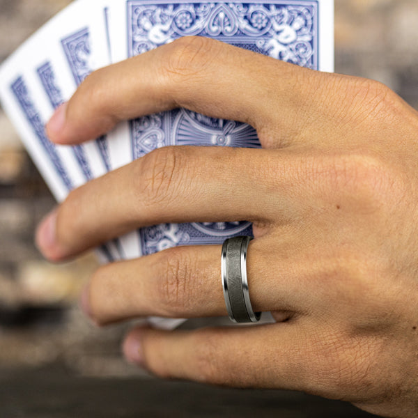 Tantalum white gold carved band on hand.