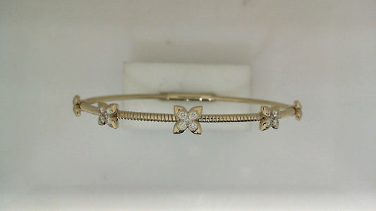 Yellow gold bracelet with diamond flower accents.