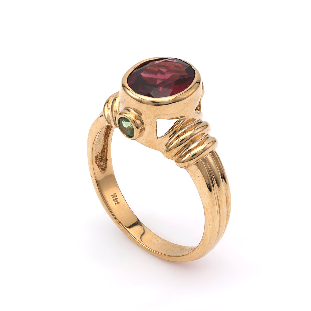 Oval Rhodolite Garnet ring in yellow gold.