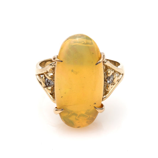 14K gold ring with opal centerpiece.