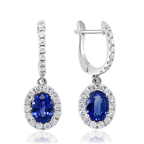 Oval sapphire earrings with diamond accents.