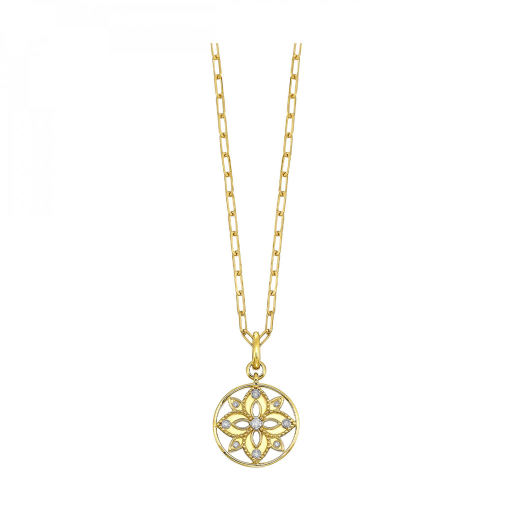 Yellow gold necklace with diamond floral pendant.