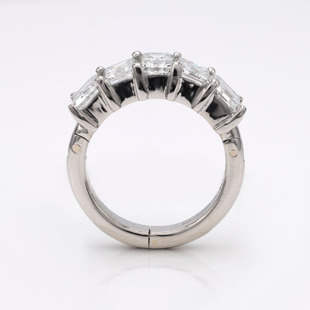 Silver ring with five rectangular gemstones.