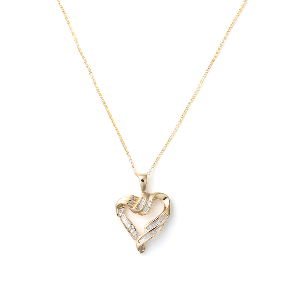 Heart-shaped gold necklace with baguette diamonds.