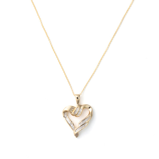 Heart-shaped gold necklace with baguette diamonds.