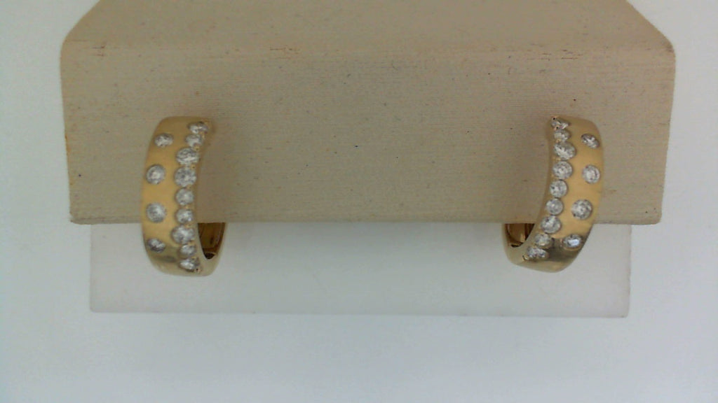 14K yellow gold hoop earrings with diamonds.