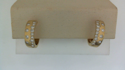 14K yellow gold hoop earrings with diamonds.