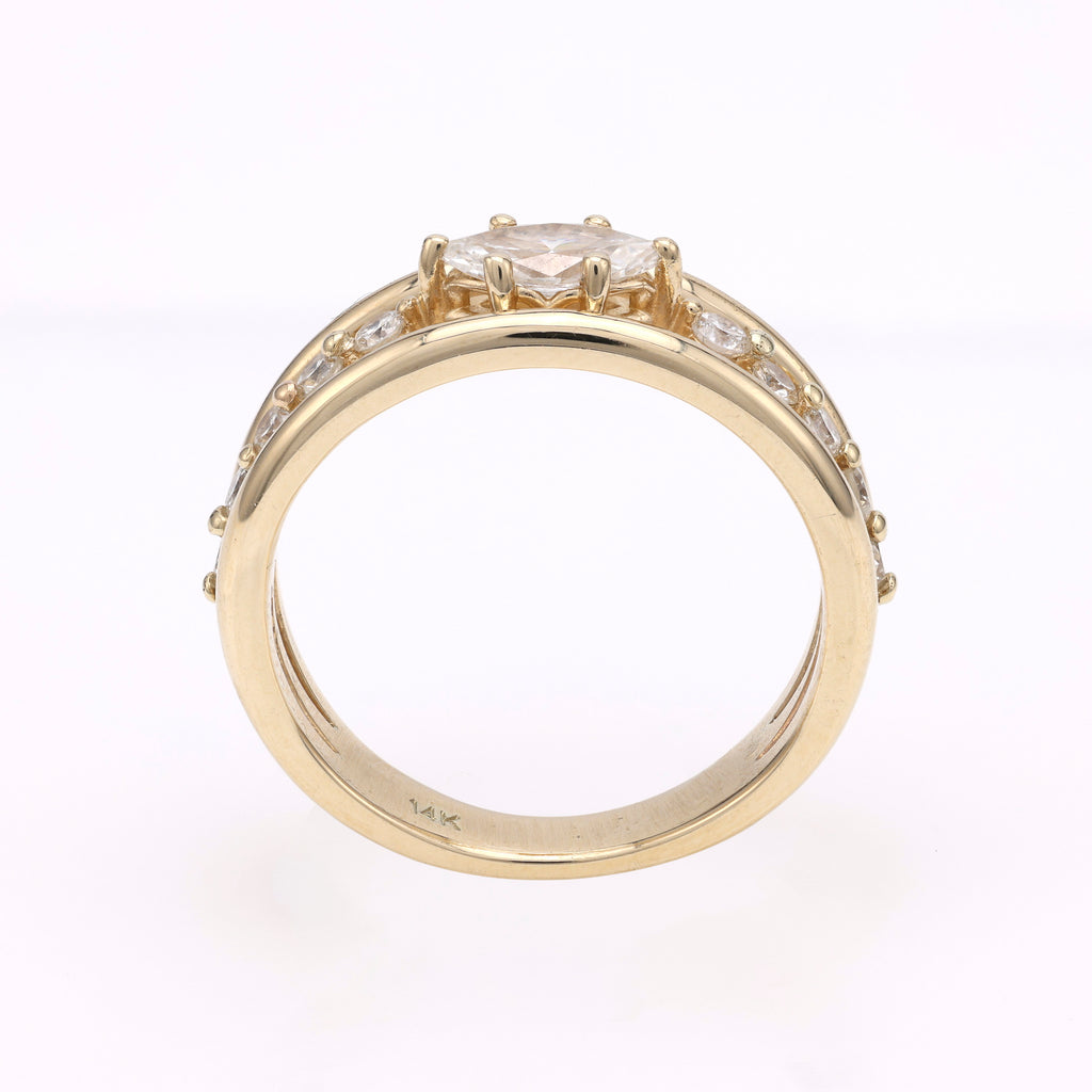 14K gold ring with marquise diamond centerpiece.