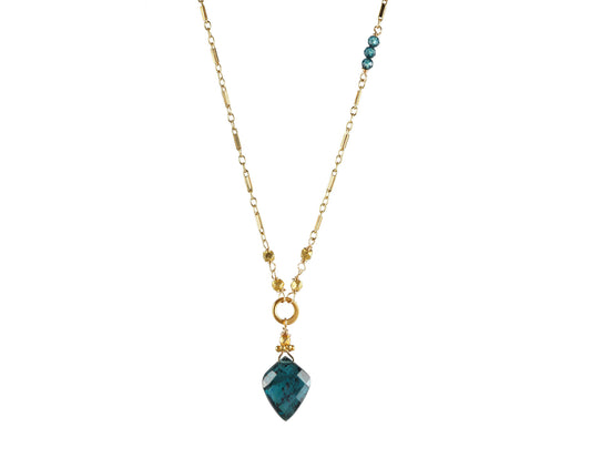 Gold necklace with teardrop kyanite pendant.