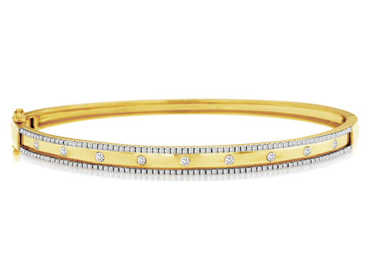 Yellow gold bangle with round diamonds.