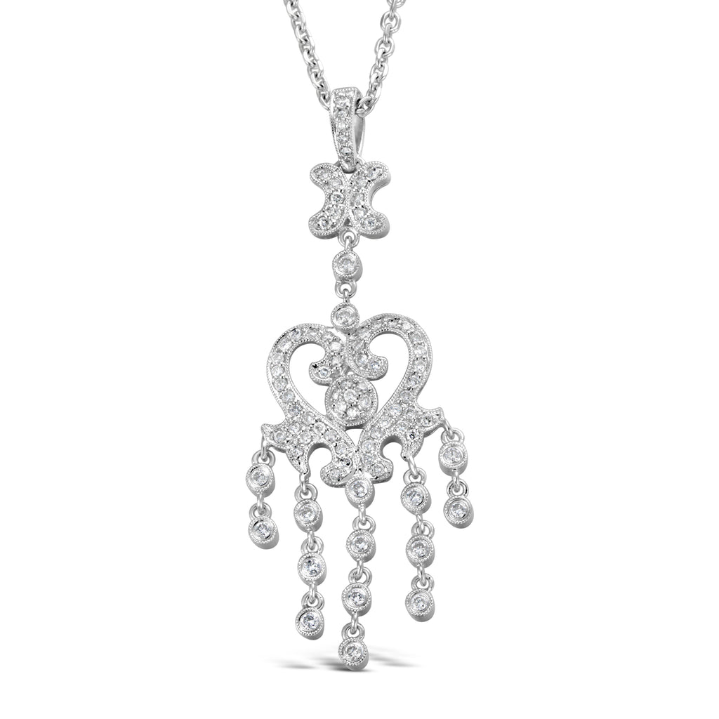 Ornate white gold diamond pendant necklace.