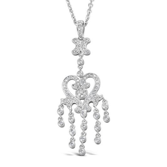 Ornate white gold diamond pendant necklace.
