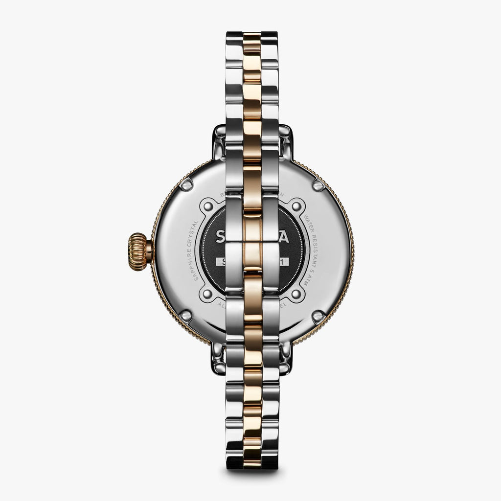Two-tone stainless steel watch back.