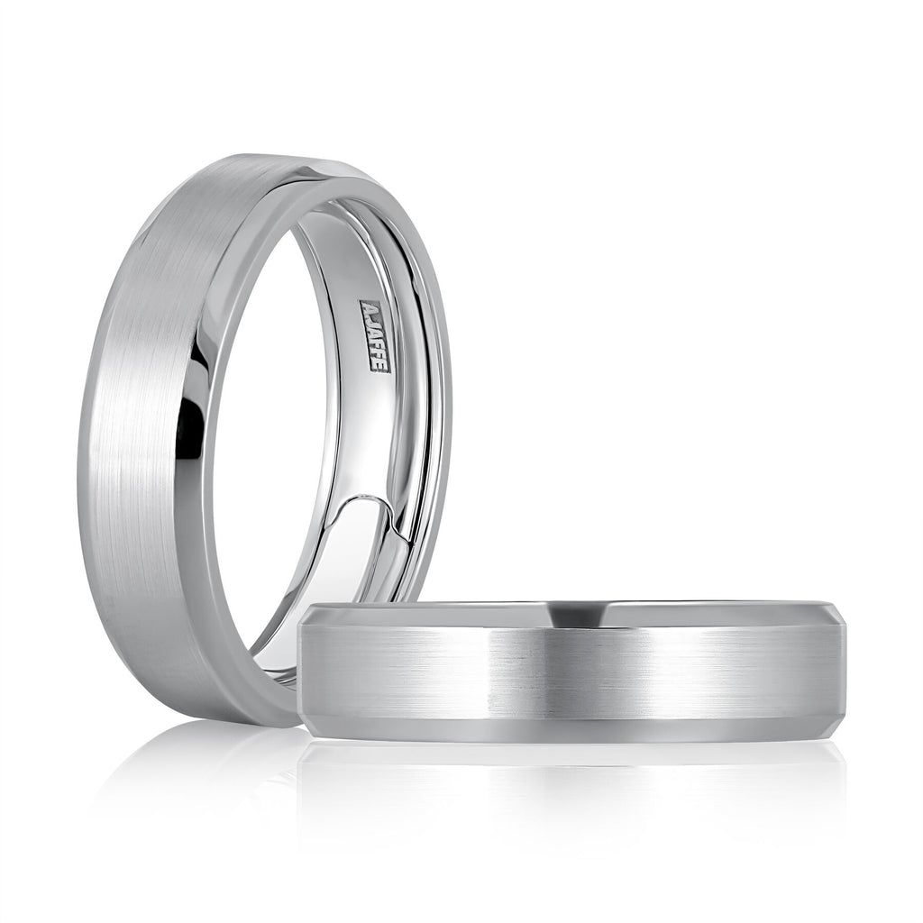 Polished satin white gold carved band.