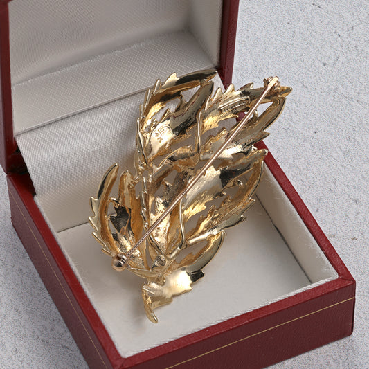 Brushed gold leaf pin in box.