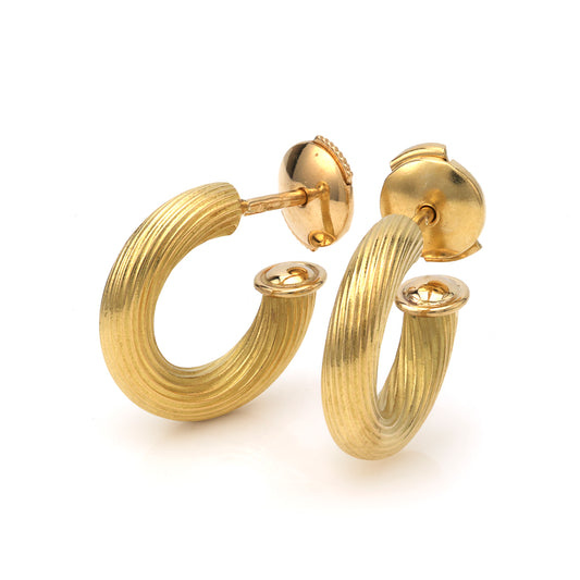 18K yellow gold textured hoop earrings.