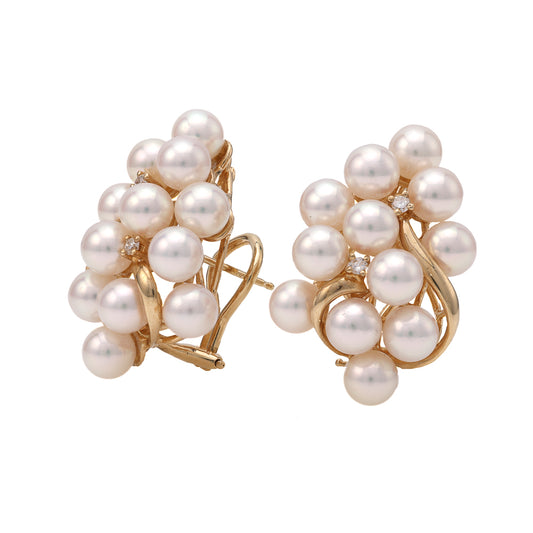 Freshwater pearl earrings with gold and diamonds.