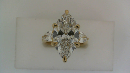 Three-stone marquise diamond ring in gold.