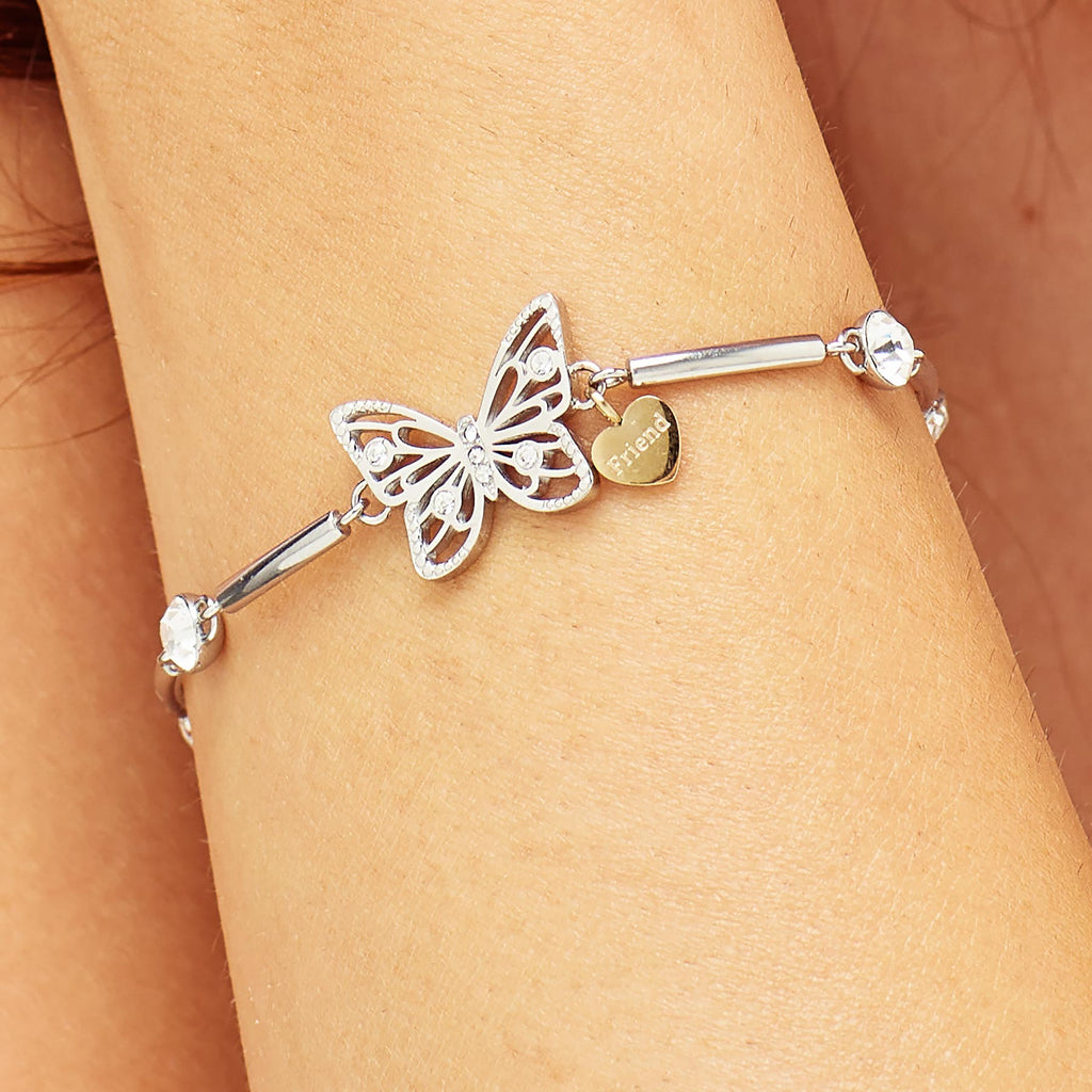 Butterfly charm bracelet with crystal accents.
