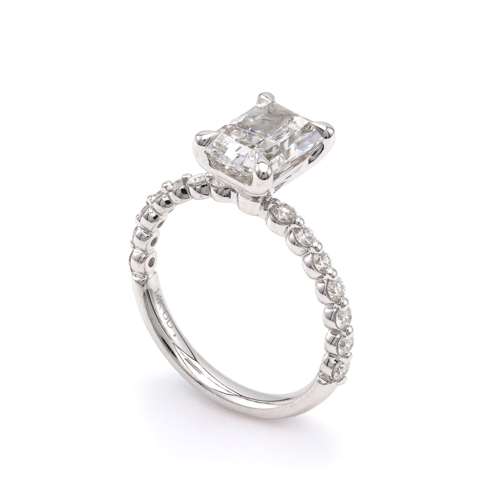 Radiant diamond engagement ring in white gold.