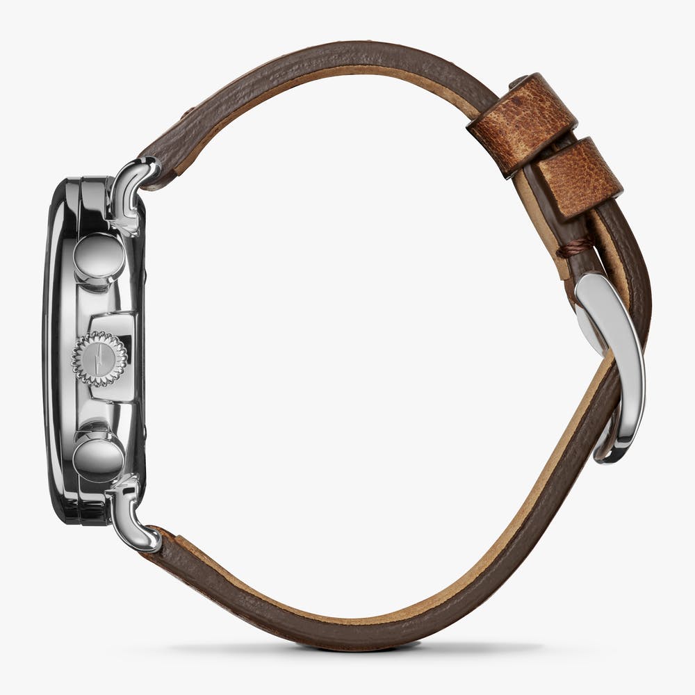 Brown leather strap, stainless steel case.