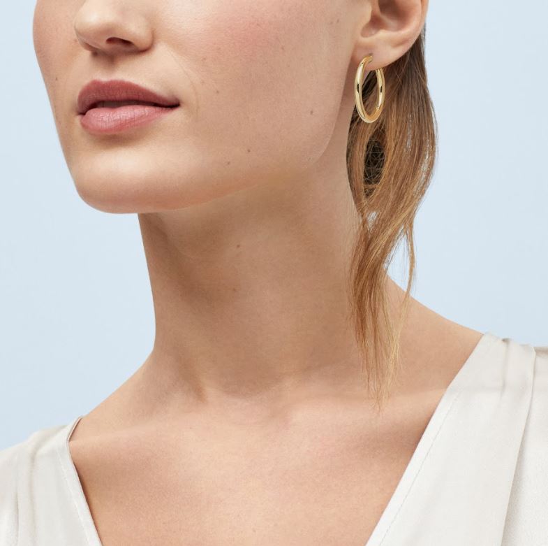 14K yellow gold large hoop earrings.