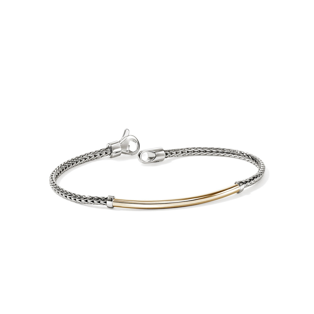 Sterling silver bracelet with yellow gold accents.