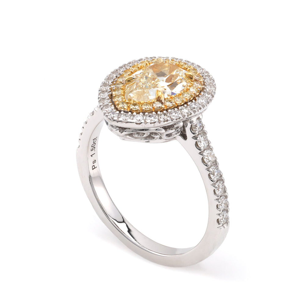 Yellow pear diamond halo engagement ring.