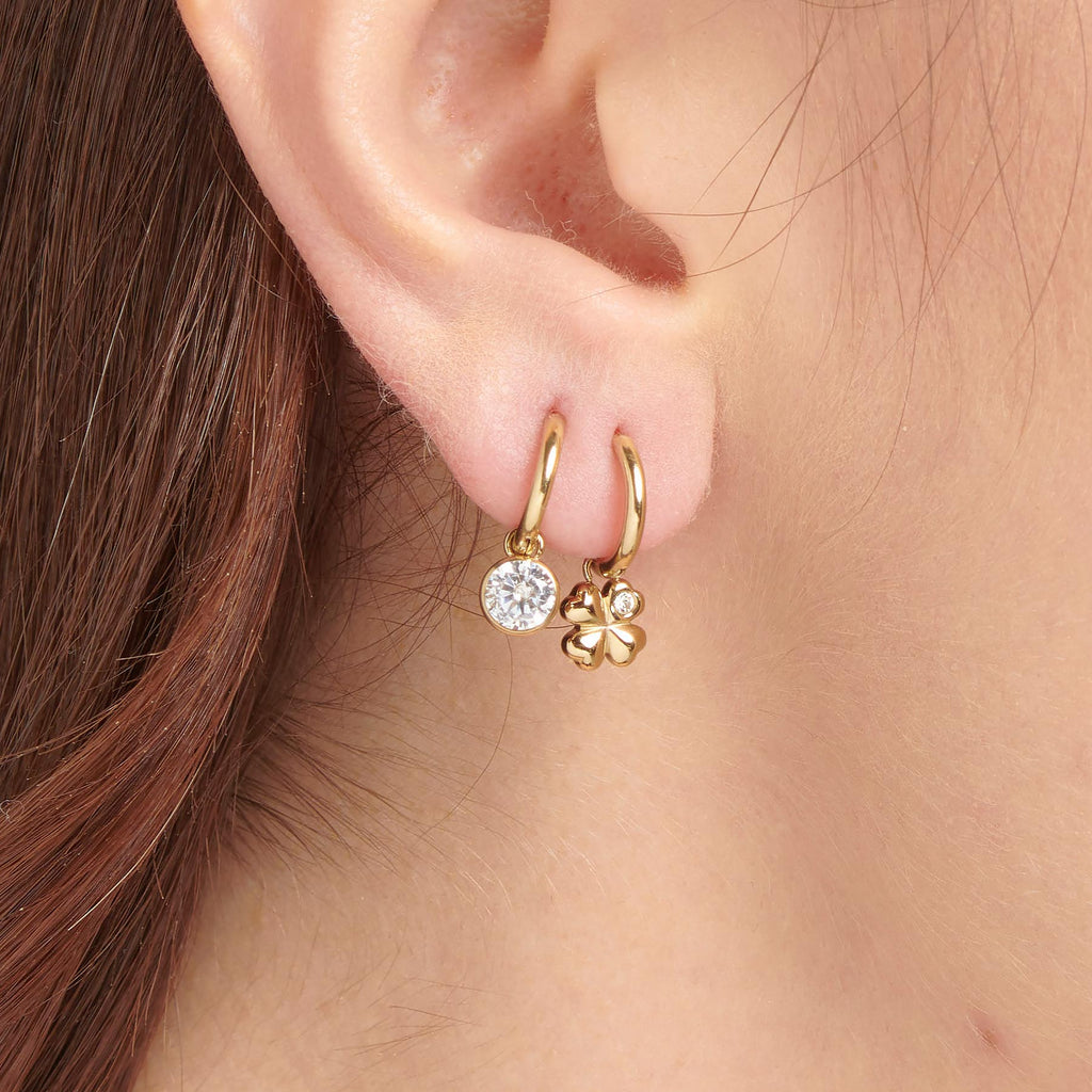Yellow dangle earrings with simulated diamonds.