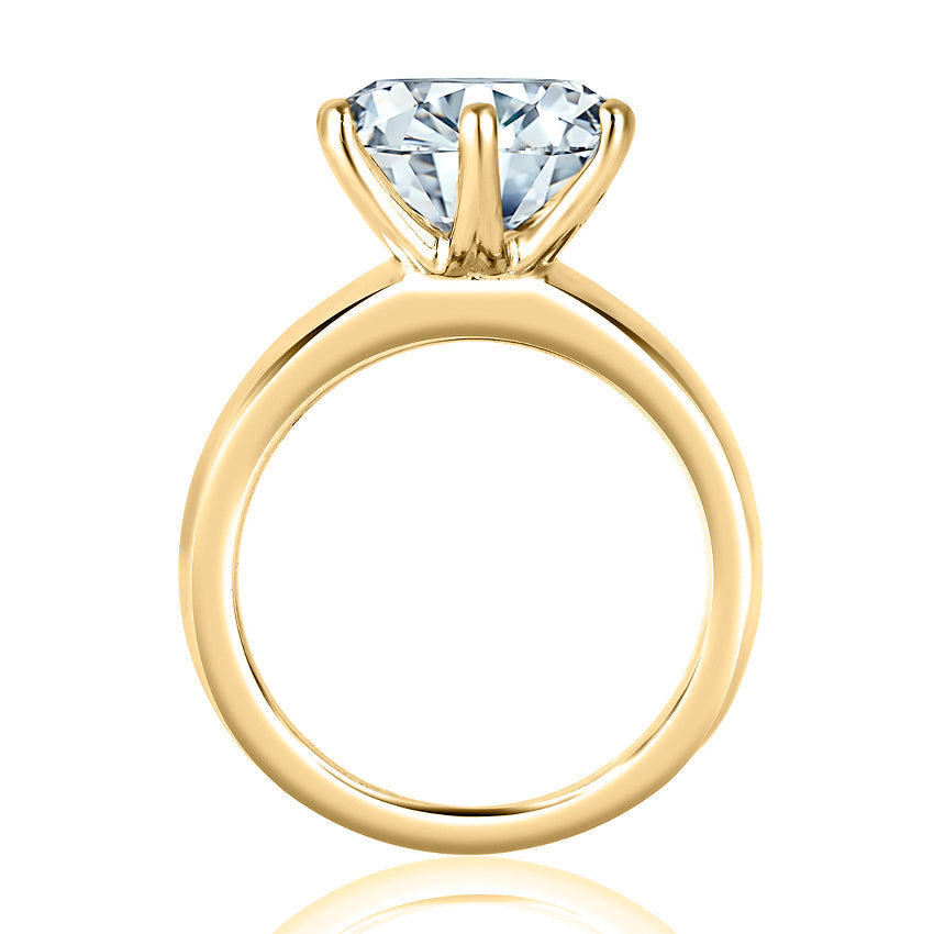 Solitaire diamond ring, yellow gold band.