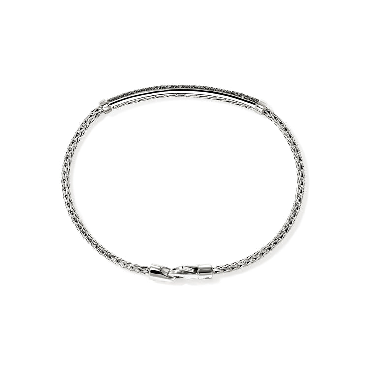 Sterling silver bracelet, black sapphire accents.