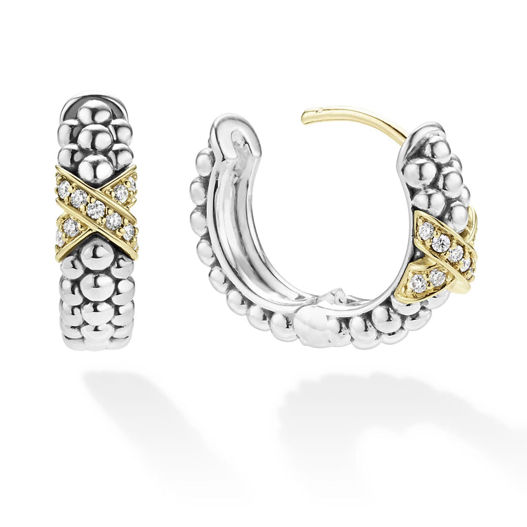 Sterling silver gold diamond huggie earrings with secure closure.
