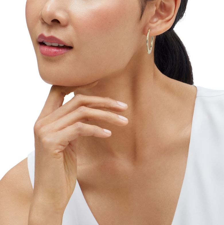 14K yellow gold medium hoop earrings.