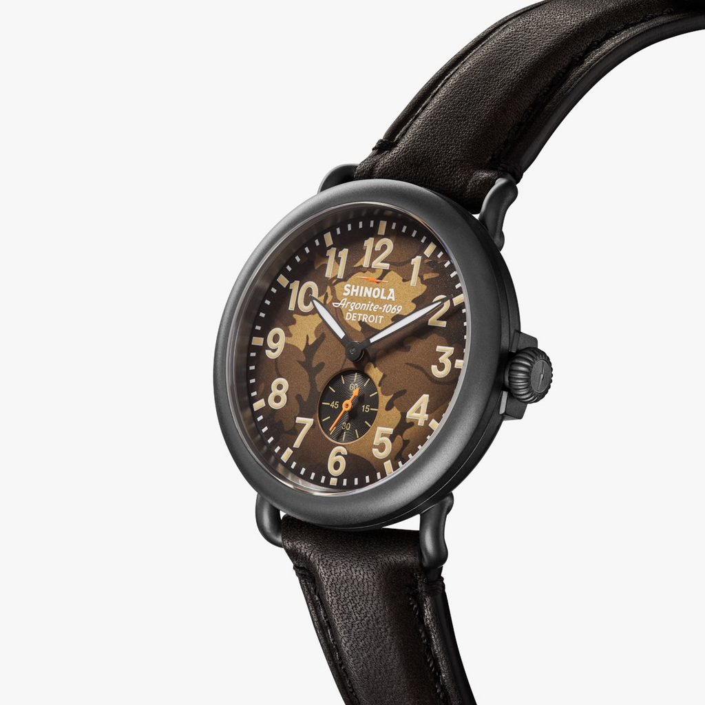 Olive camo dial, black case, leather strap.