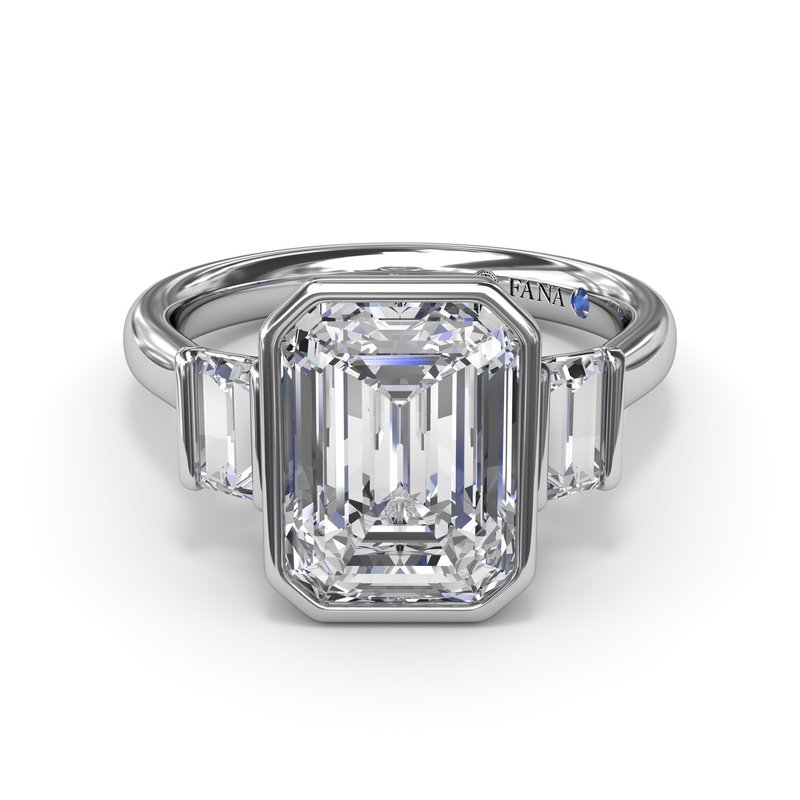 Emerald-cut diamond ring with side stones.