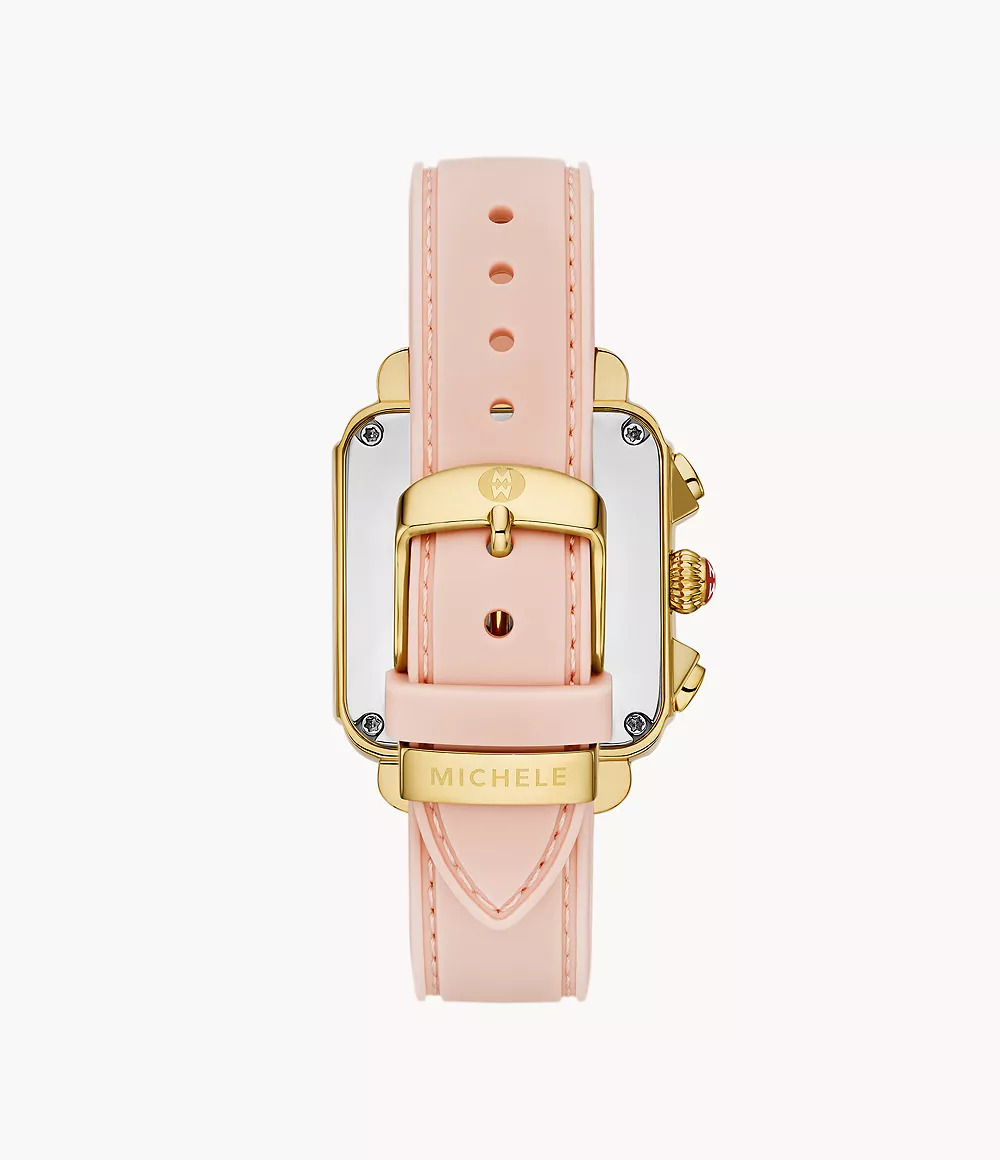 Gold-plated watch with pink silicone strap.
