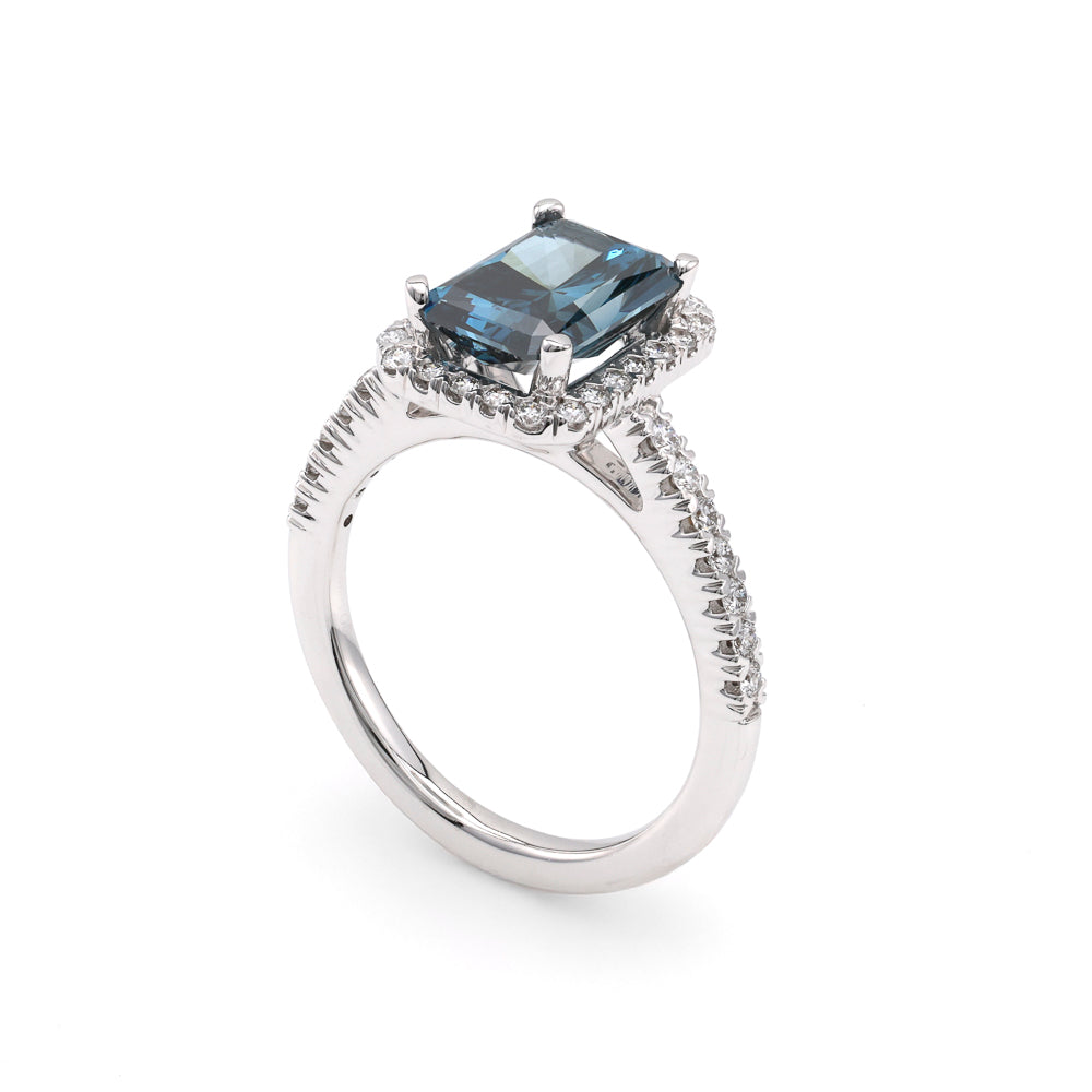 Blue radiant diamond halo engagement ring.