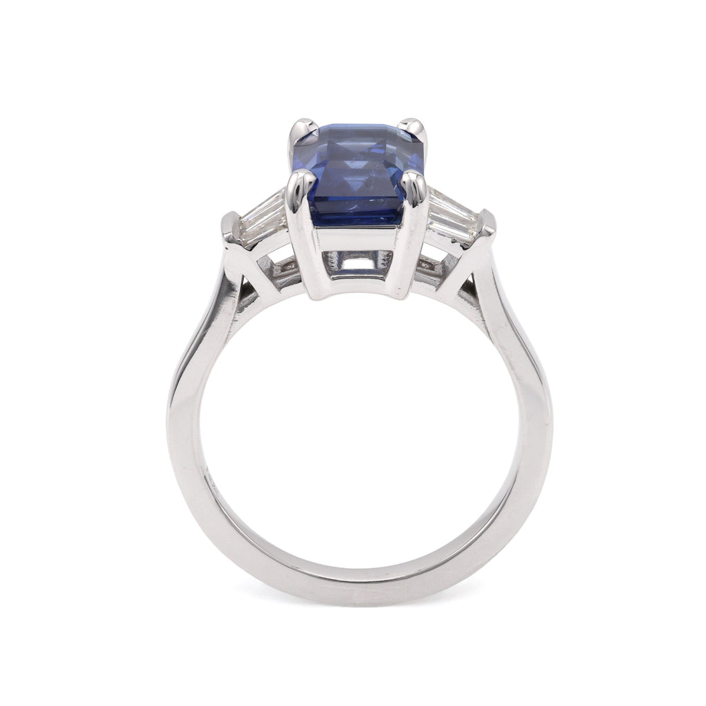 Emerald sapphire ring with baguette diamonds.