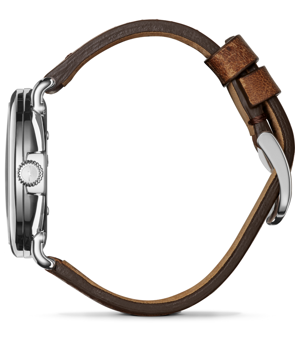 Stainless steel watch, brown leather strap.