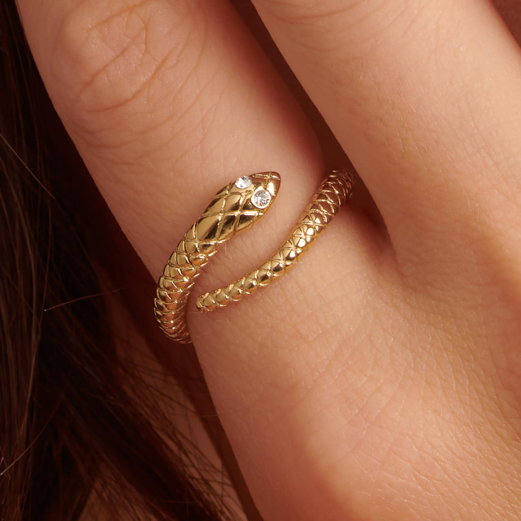 Gold snake ring with diamond eyes.