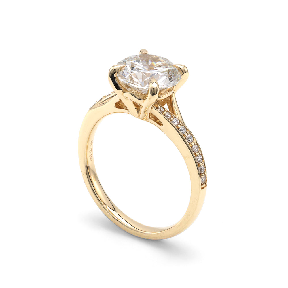 Yellow gold ring with round lab-grown diamond.