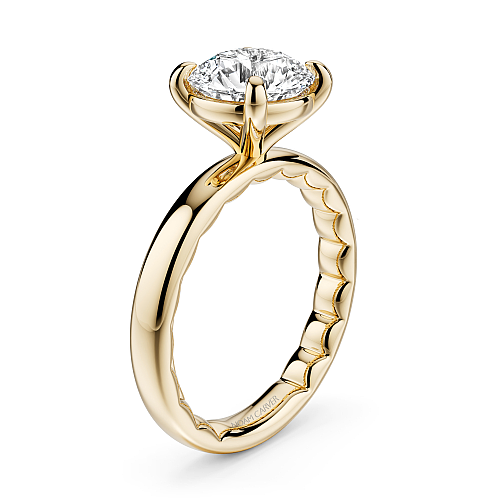 Solitaire diamond ring in yellow gold setting.