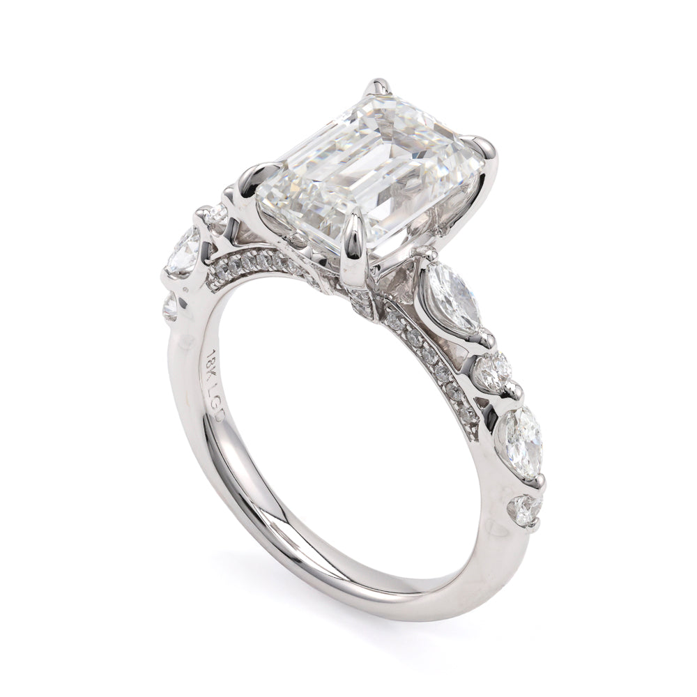 18K white gold ring with emerald diamond.