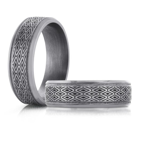 Tantalum band with geometric carved design.