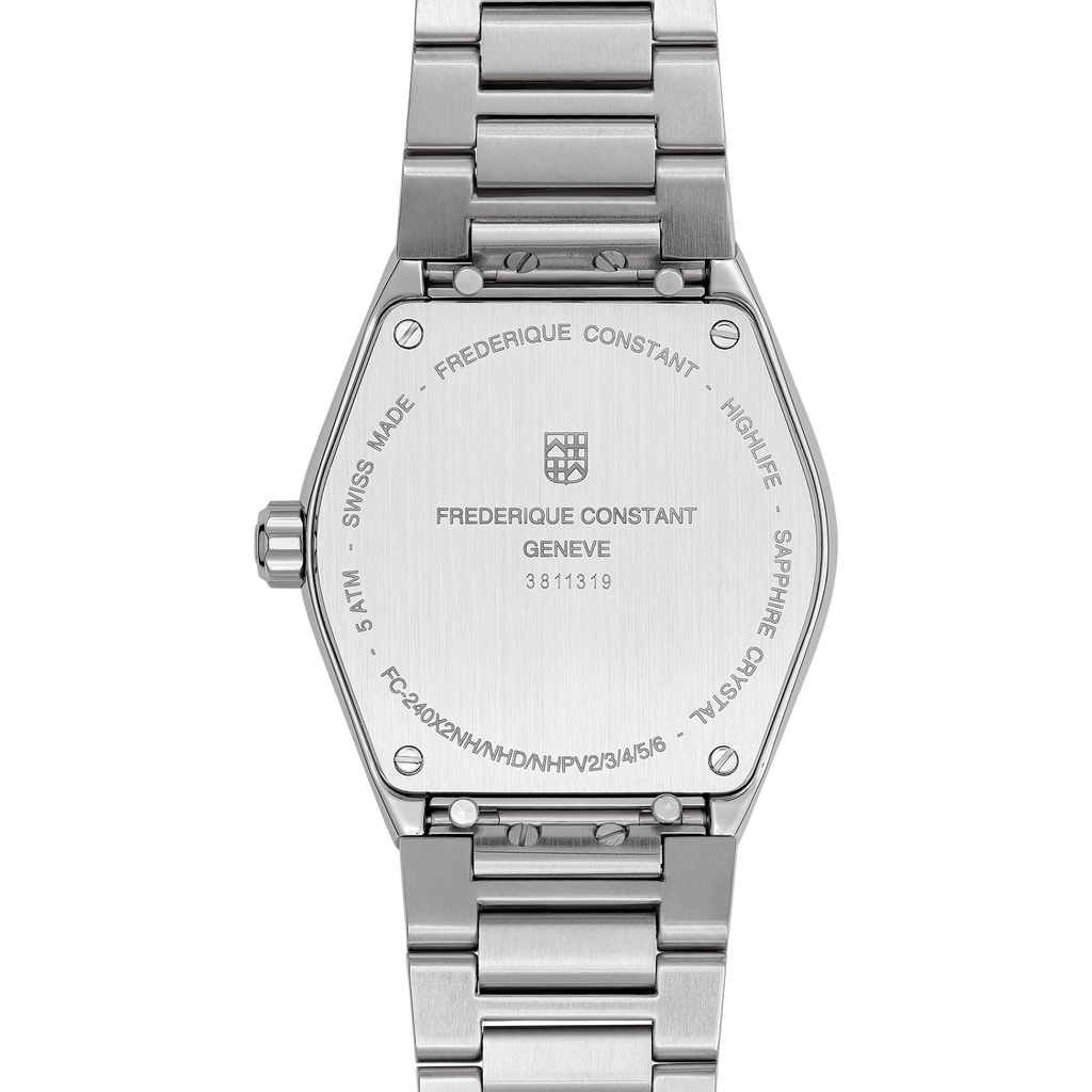 Stainless steel watch back with engraved text.