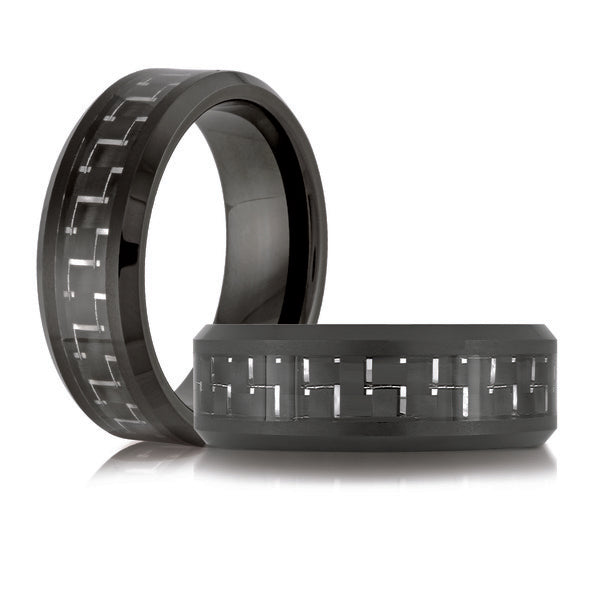 Black tungsten carbide band with carved design.