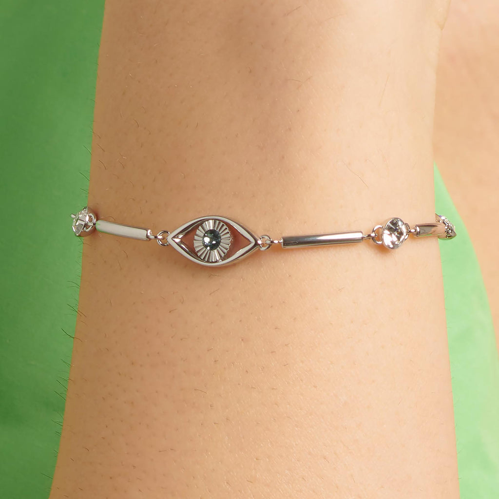 Stainless steel bracelet with eye-shaped gemstone.