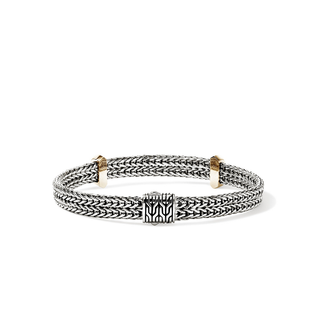 Sterling silver bracelet with gold accents.