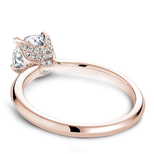 Rose gold ring with solitaire diamond and accents.