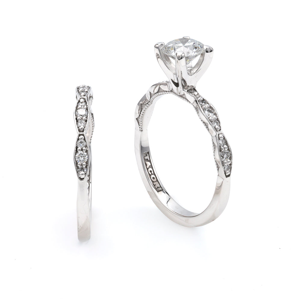 18K white gold band with round diamonds.